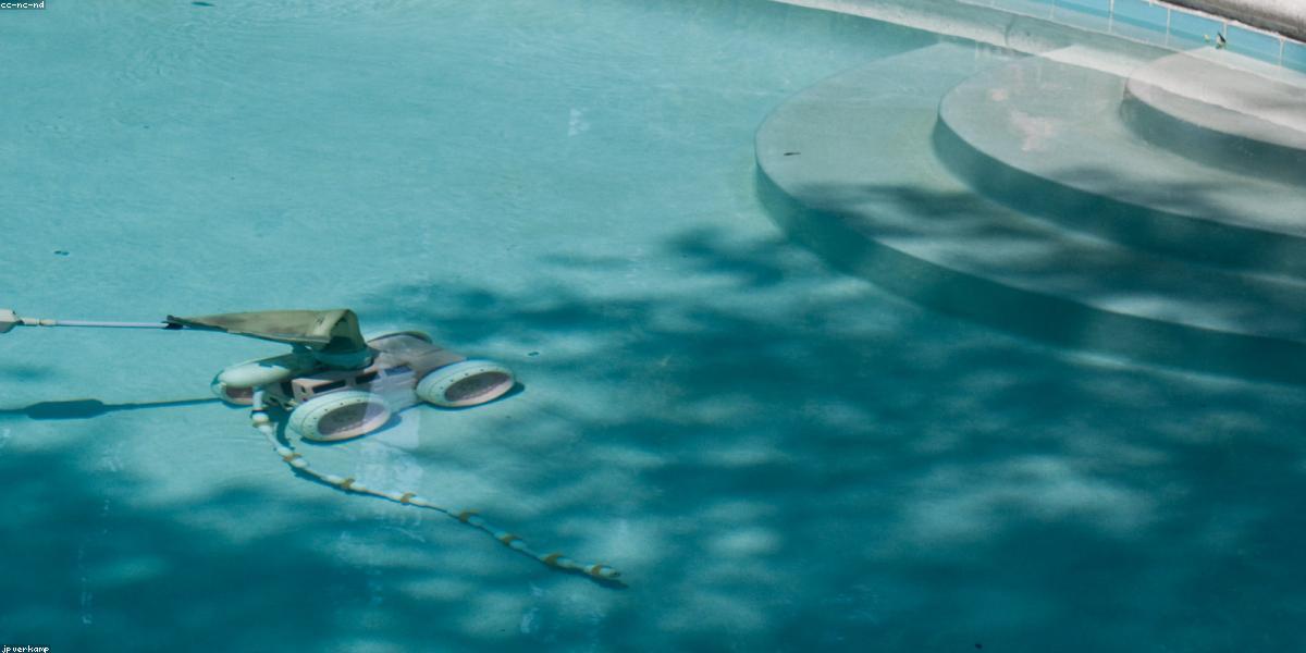 Pool technician performing eco maintenance